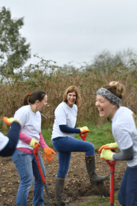 Staff having fun whilst digging