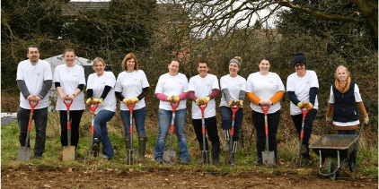 Group of volunteers with their spades