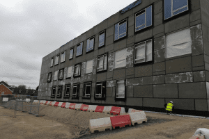 An outside view of the school under construction