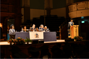 UCEM Principal, Ashley Wheaton addressing the guests at the UCEM graduation ceremony, which took place in the Reading Town Hall