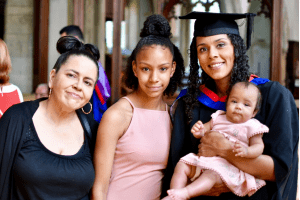 A recent graduate with her family/friends soon after the UCEM graduation ceremony that took place in Reading Town Hall