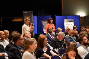 Audience member asking the panel a question