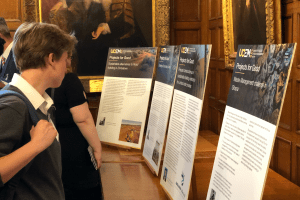 An attendee admiring the displays at the Projects for Good Exhibition