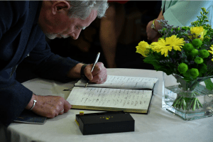 Signing the guest book