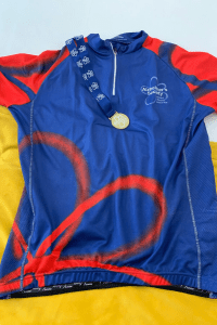 Lee's Alzheimer's Society cycle top and bike ride medal