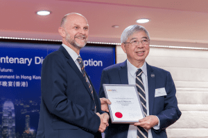 UCEM Principal, Ashley Wheaton, presents Professor Stephen Ho with his Honorary Fellow certificate at our Hong Kong centenary event