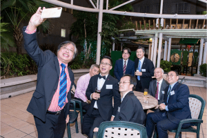 Guests taking a selfie at our Hong Kong centenary event