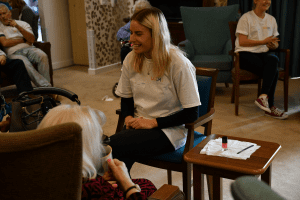 The volunteers chatting with the residents