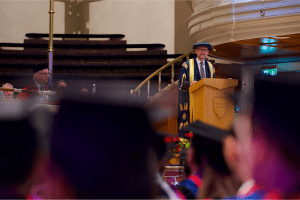 UCEM Principal, Ashley Wheaton, addressing graduands at the December 2019 Graduation