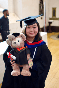 A graduate poses for the camera at the December 2019 UCEM Graduation
