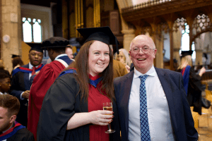 A graduate sharing a joke at the December 2019 UCEM Graduation