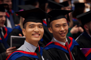 A group pose for a photo at the December 2019 UCEM Graduation