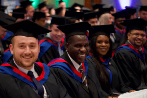 A happy graduate sat down for the December 2019 UCEM Graduation