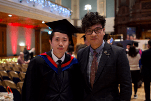 A graduate with Head of APAC Office and Director, UCEM Asia Ltd, Robert Chan, at the December 2019 UCEM Graduation