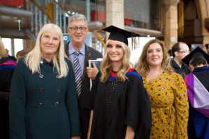 A group pose for a photo at the December 2019 UCEM Graduation