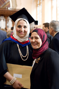A graduate poses with a family member at the December 2019 UCEM Graduation
