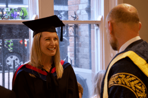 A happy graduate at the December 2019 UCEM Graduation