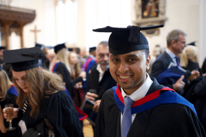 A happy graduate at the December 2019 UCEM Graduation