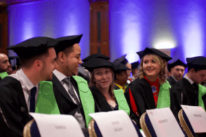 A group of graduands in conversation before the December 2019 UCEM Graduation ceremony