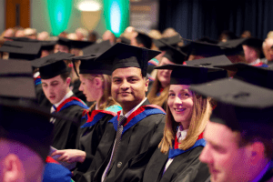 A couple of graduands posing for a photo before the ceremony at the December 2019 UCEM Graduation