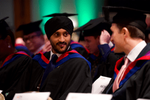 A graduand in conversation at the December 2019 UCEM Graduation