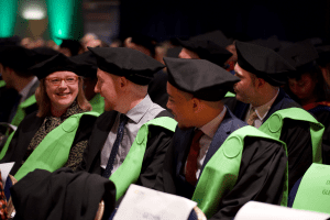 A group of graduands in conversation at the December 2019 UCEM Graduation