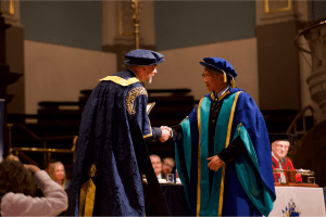 Cary Chan receiving his Honorary Doctorate from UCEM Principal, Ashley Wheaton, at the December 2019 UCEM Graduation