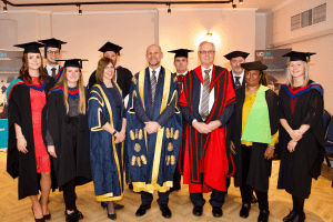 UCEM Deputy Principal, Jane Fawkes, Principal, Ashley Wheaton, and Vice Chair, Dr Stephen Jackson, with undergraduate award winners at the December 2019 UCEM Graduation