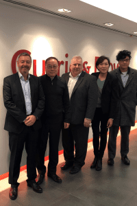 Martin Cawley, Tim Bennett and Robert Chan with members of Currie & Brown's Hong Kong team