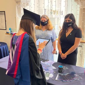 A graduand signing up to the Alumni Association on an iPad