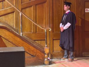 A graduand waits to go on stage