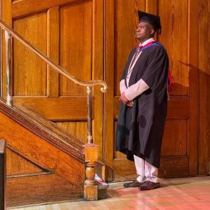 A graduand waits to be called up to the stage