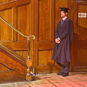 A graduand waits to go on the stage