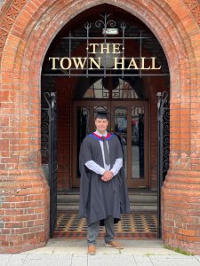 Graduate outside the town hall