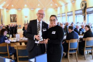 Alumni of the year award winner with the chair of trustees