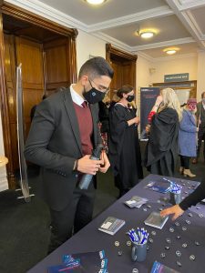 A graduand at the alumni stand