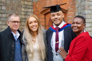 A graduand with his family
