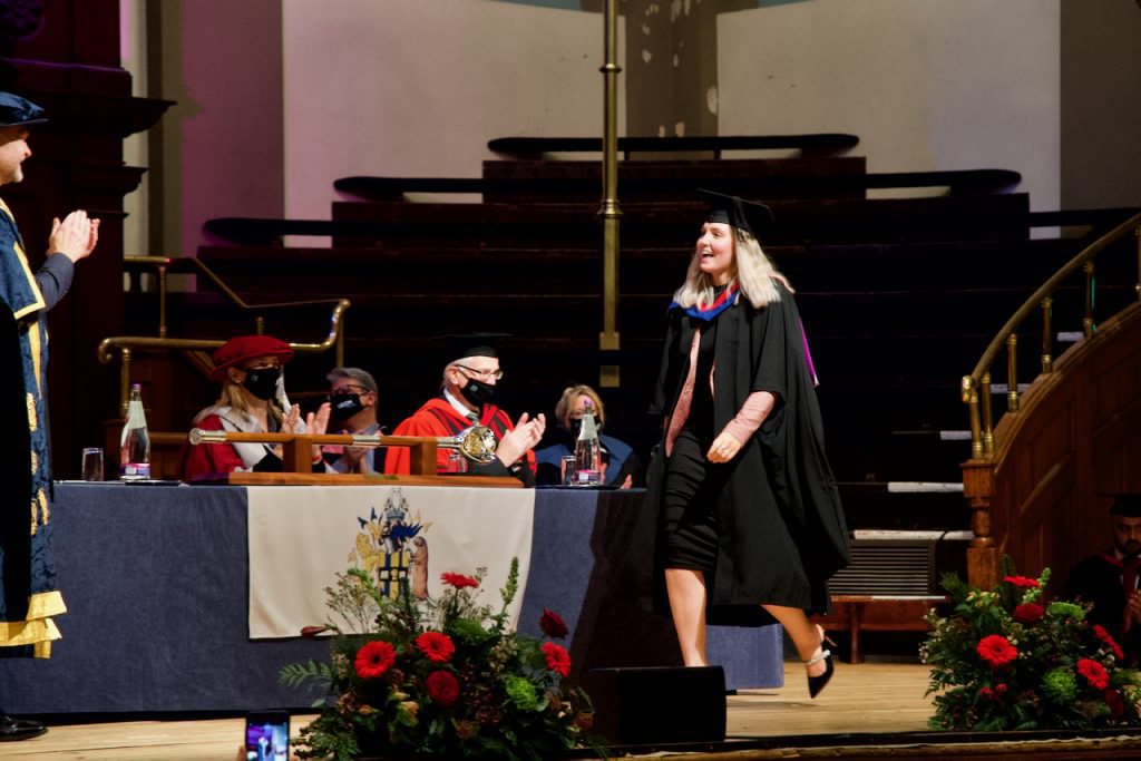 A graduand on the stage