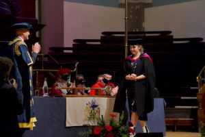 A graduand on the stage