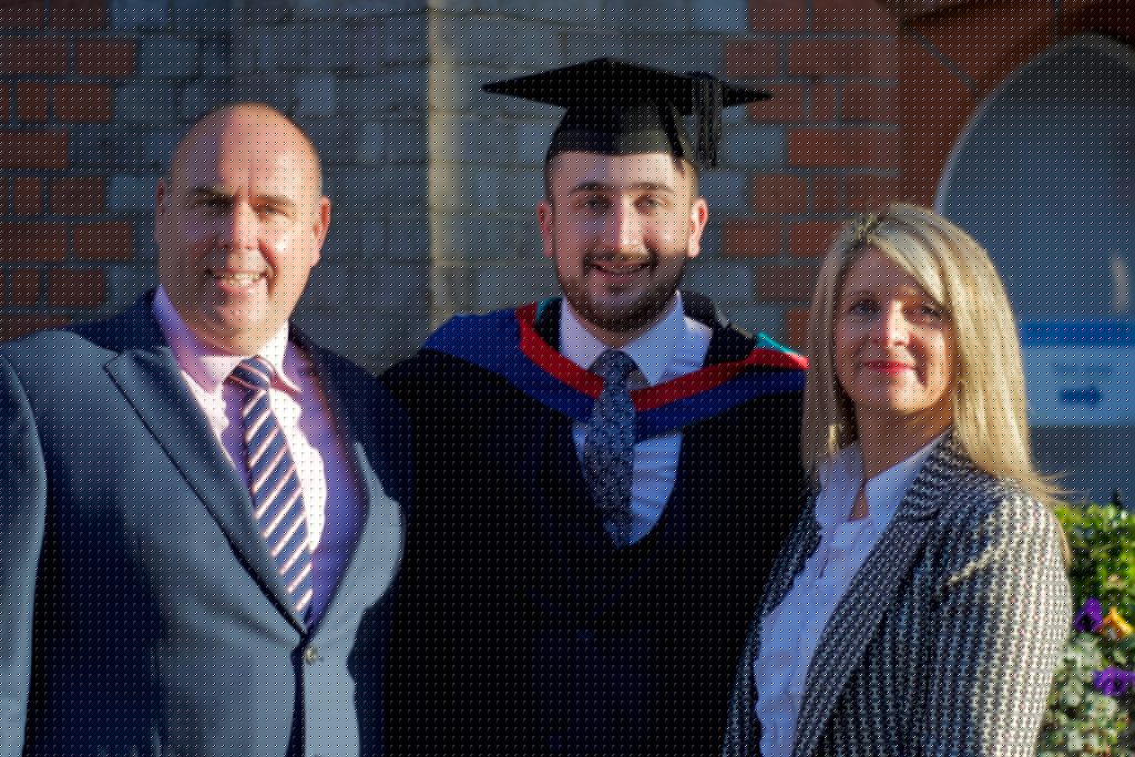 A graduand with his family