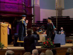 A graduand on the stage