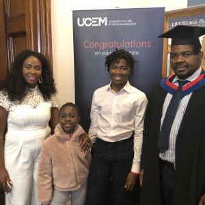 A graduand with his family