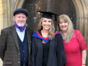 A graduand with her guests