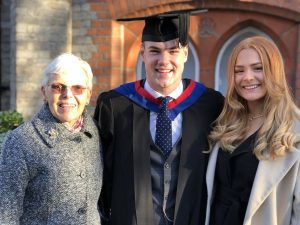 A graduand with his guests