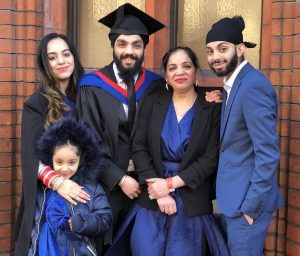 A graduand with his family