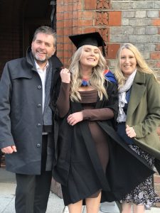 A graduand and her guests