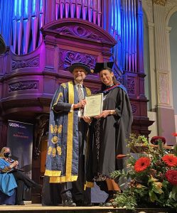 A graduand receives her award