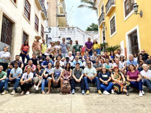 Muhammad and his peers sit down for a photo in Brazil